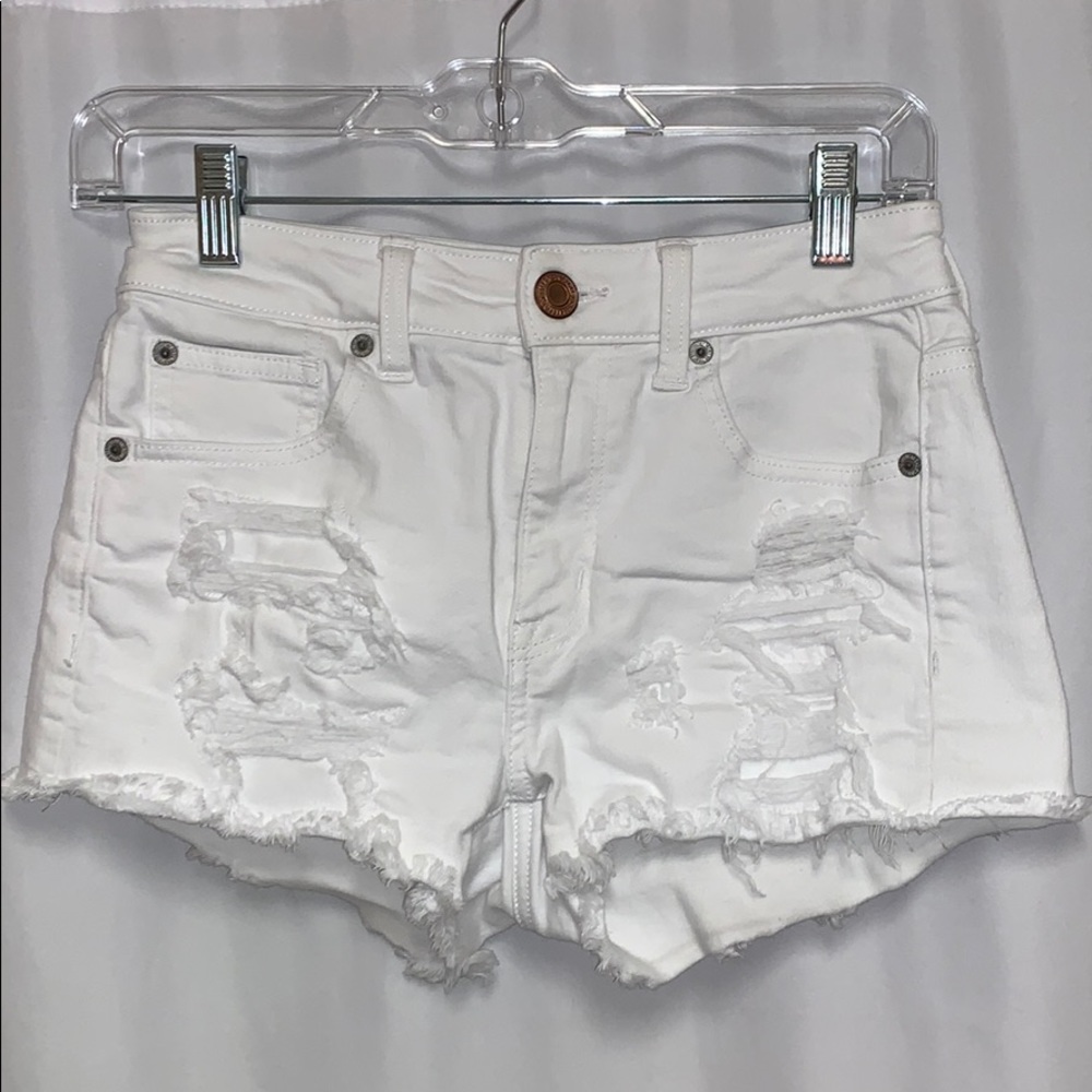 White ripped jean shorts